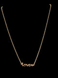 Gold tone love necklace